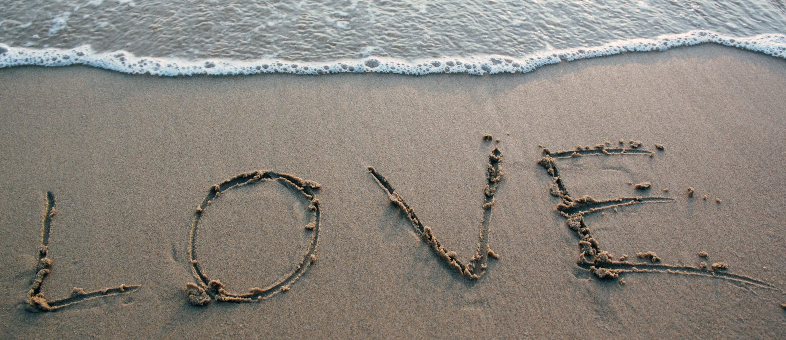 love-in-sand-pexels less